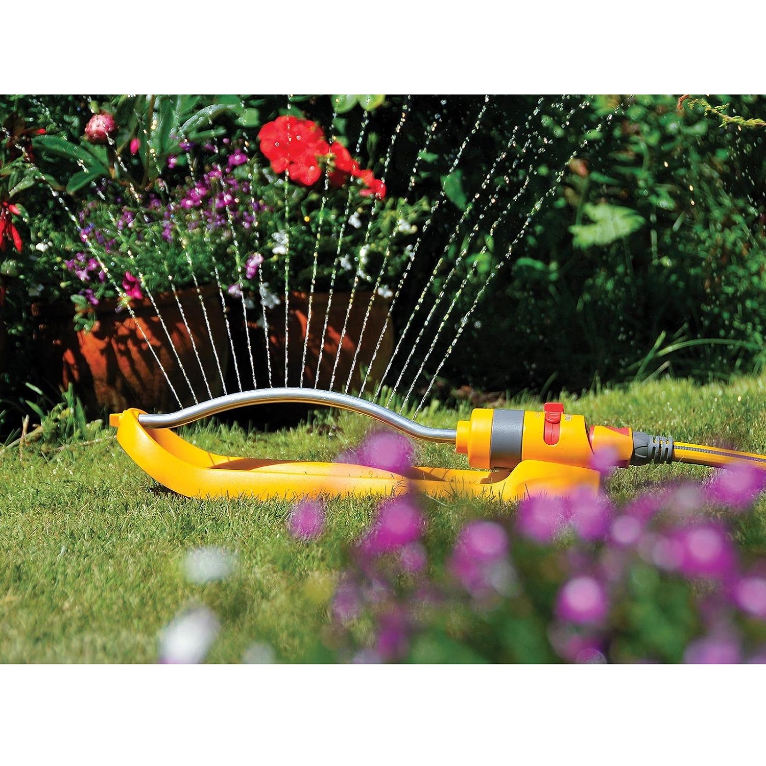 Hozelock Rectangular Oscillating Sprinkler Plus Yellow and Grey 15Mtr x 13Mtr 2974 | Medium Area Tractor Mounted Spray Lawn Sprinkler | 200Mtr Square Coverage | Stable Sled Base | Adjustable Oscillation Zone | 17 Jets Even Coverage | Water Powered Gear Drive Motor | Metal and Plastic Material For Lawns And Established Plants | Supplied with Complete Fittings